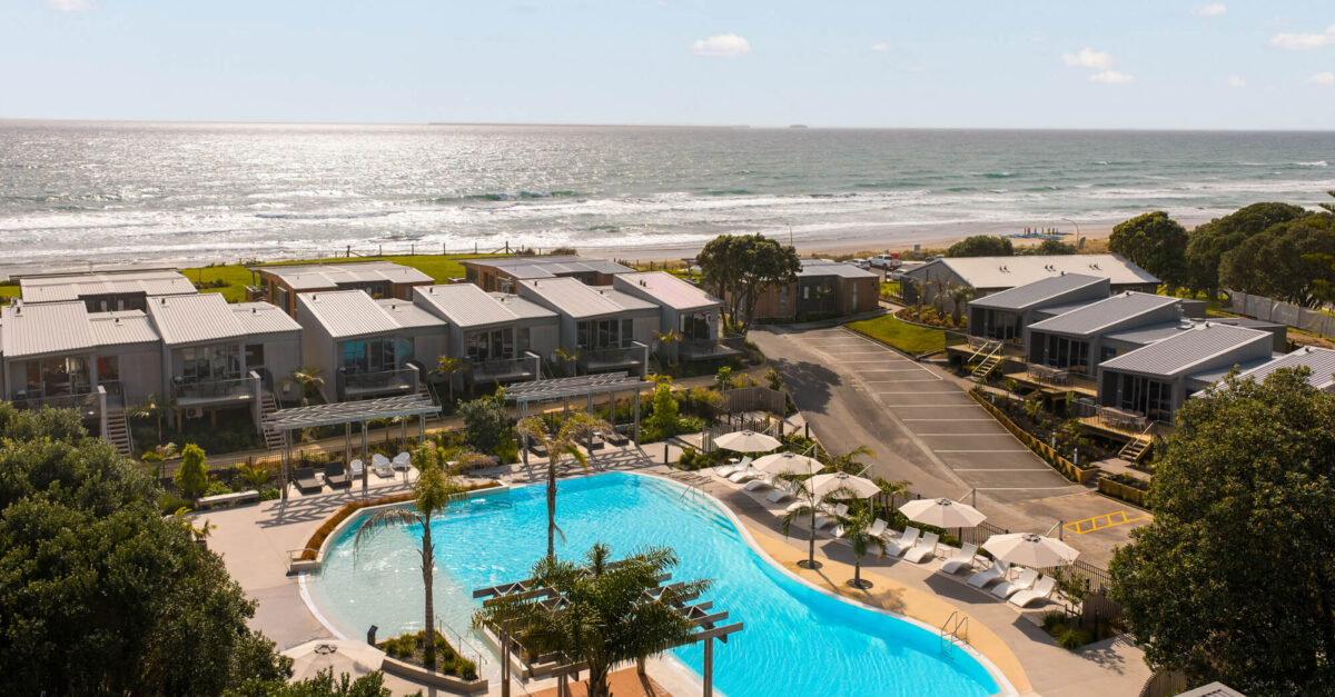 What time can I check in to and check out of my Papamoa Beach accommodation?